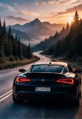 A car on a mountain road at sunset